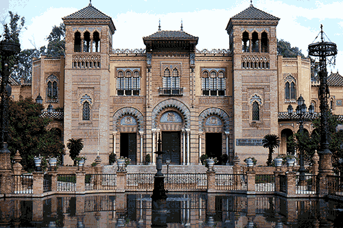 Museum of Popular Arts and Customs, now Museum of Arts & Traditions of Sevilla, at Seville, Andalusia, Spain in 1976.  Built in 1914, the exterior of the building is ceramic over brick & the archivolts, ornamental molding, over each door is composed of glazed tiles.