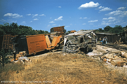 Railroaders check the aftermath of a freight train derailment in Pottsboro, Texas in 1957.  